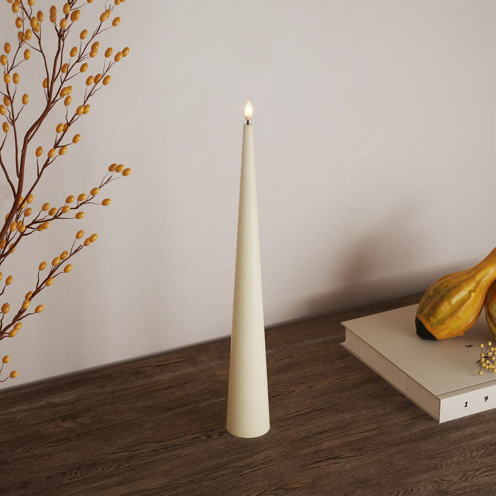 Cream 20cm LED cone candle on a wooden tabletop
