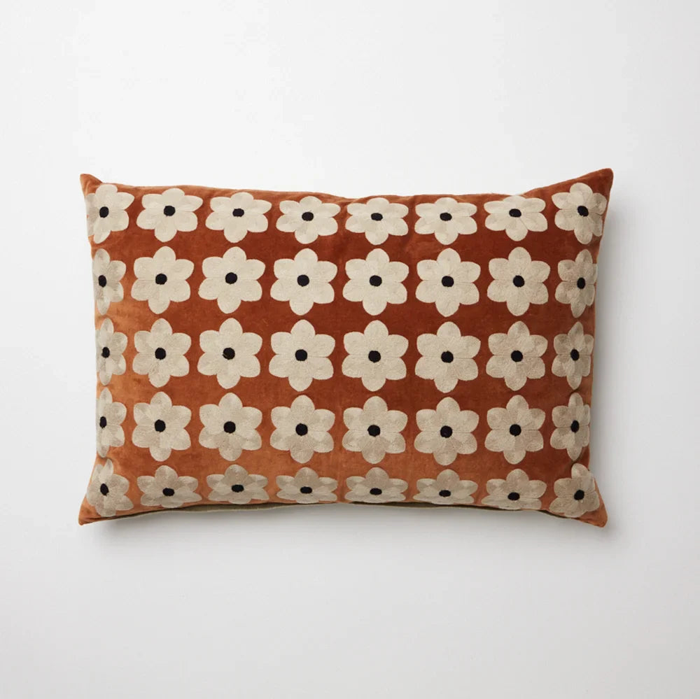 Daisy rust velvet cushion with embroidered cream flowers by Olsson & Jensen, front view