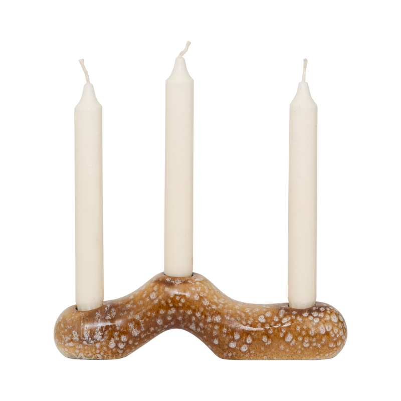 Daru candle holder holding three ivory dinner candles