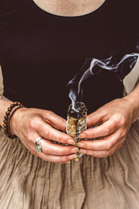 Handmade smudge stick with white sage and braided sweetgrass
