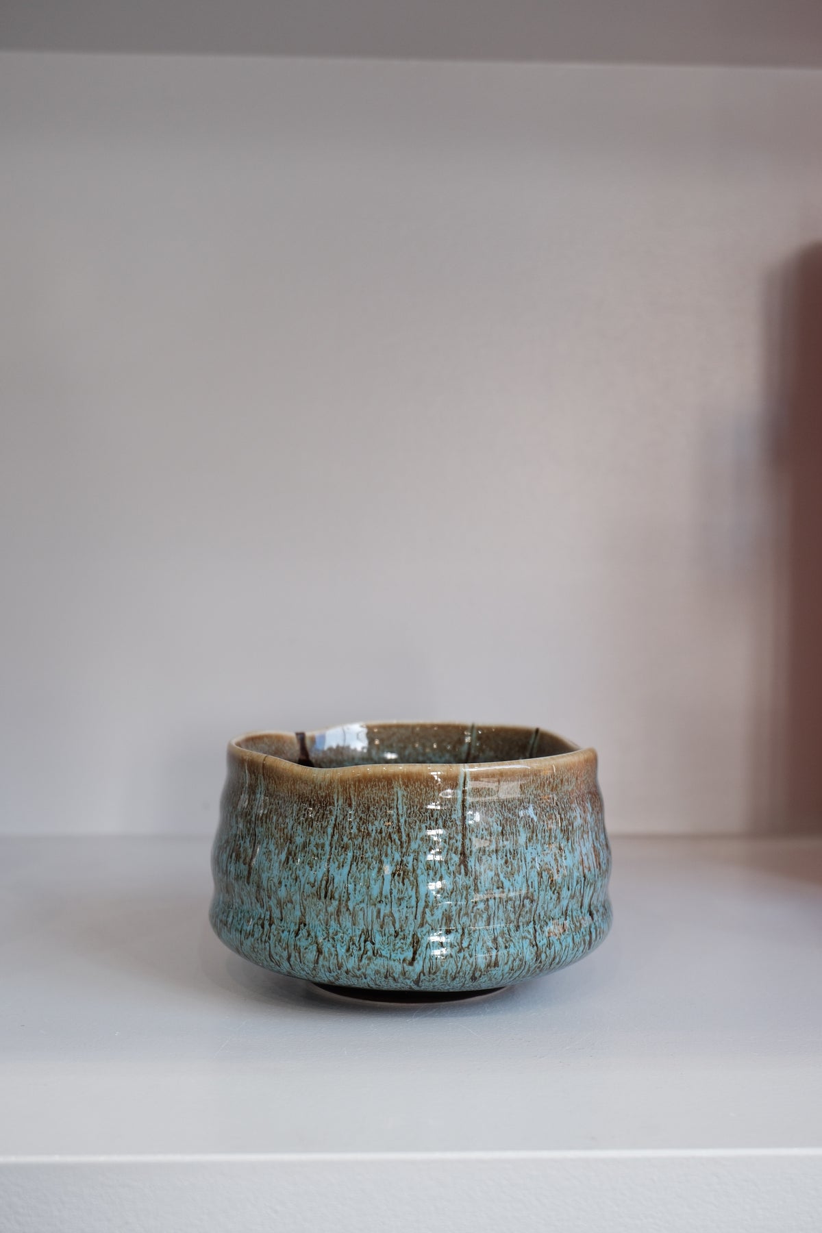 close-up of eco blue matcha bowl showing natural glaze variation
