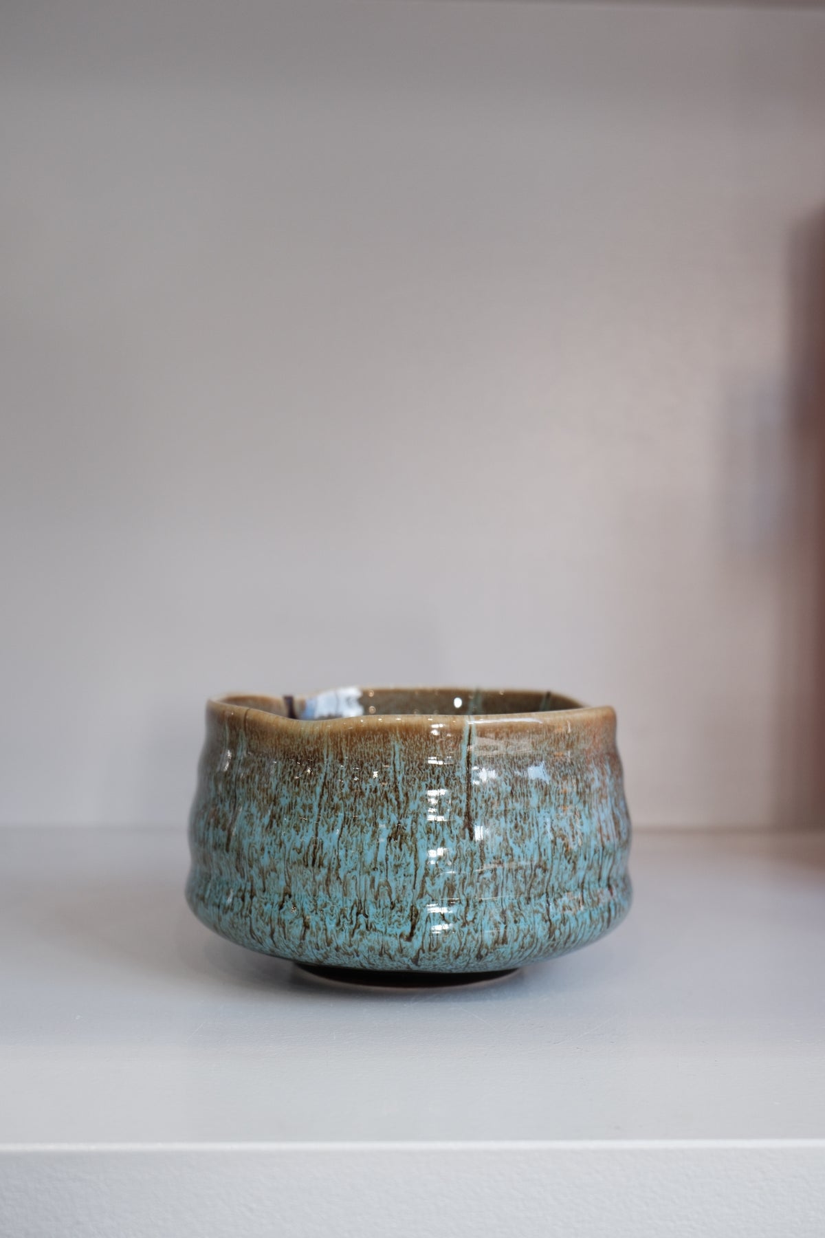 eco blue matcha bowl showing finger grooves and reactive glaze