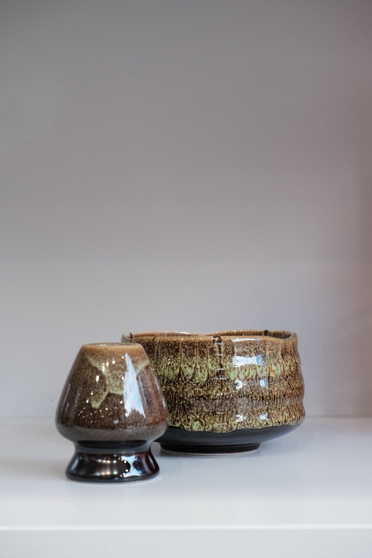 eco green ceramic matcha bowl with organic green and brown glaze
