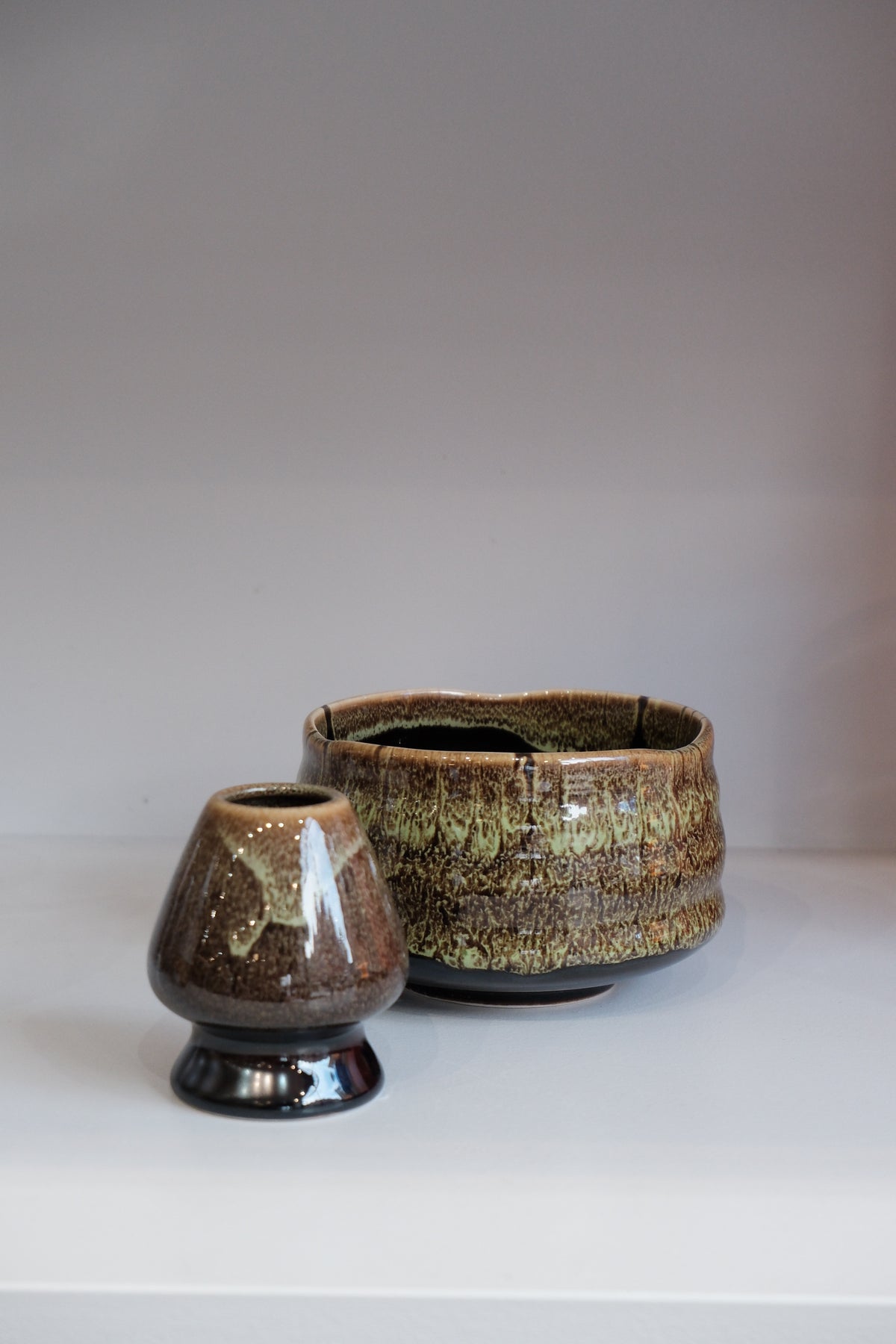 eco green matcha whisk holder with earthy glazed finish
