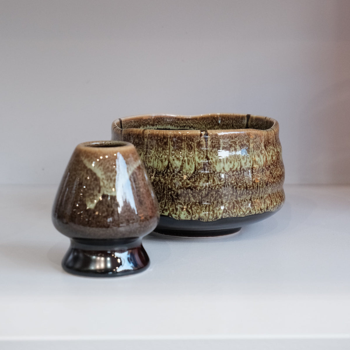 eco green matcha bowl with matching whisk holder in earthy green glaze