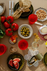 Eden olive green plates by Olsson & Jensen on a summer lunch table from above