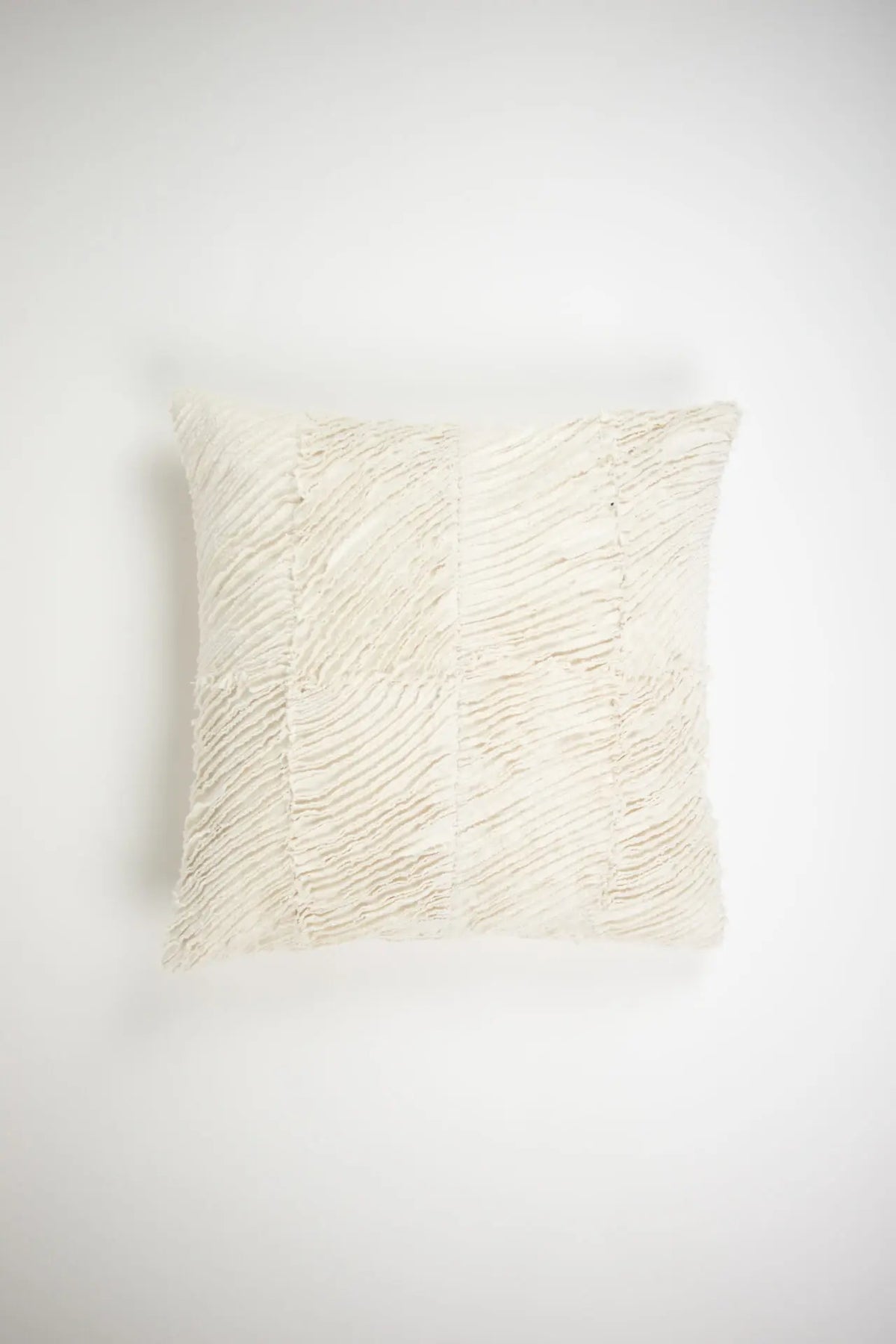Elba cream textured cotton cushion 50x50 cm by Olsson & Jensen with raw-edged wave pattern, front view