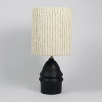 Ella black lamp base by Olsson & Jensen shown with a textured cream shade (shade sold separately)