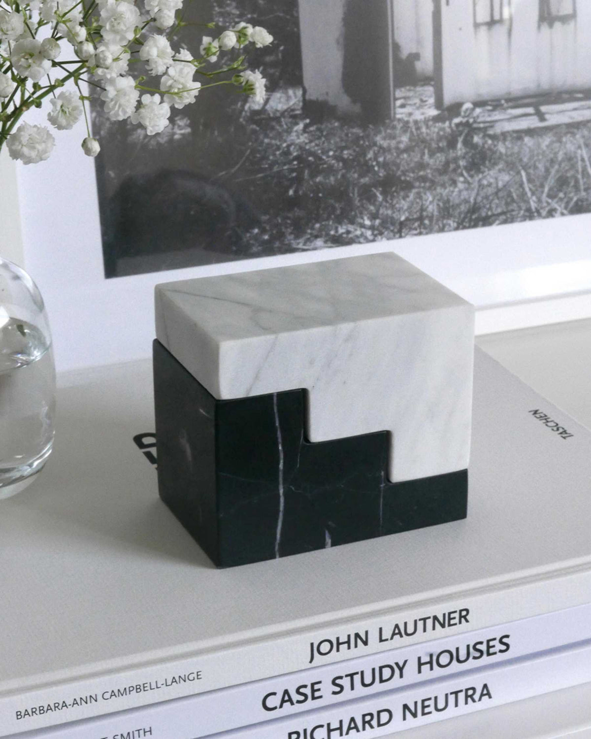 geometric marble bookends stacked into a sculptural cube
