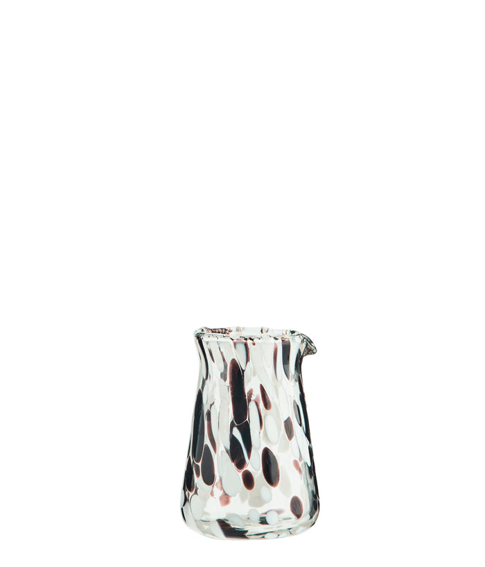 handmade glass milk jug with brown and white speckled pattern
