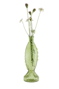 green fish-shaped glass vase with textured scales styled with delicate stems
