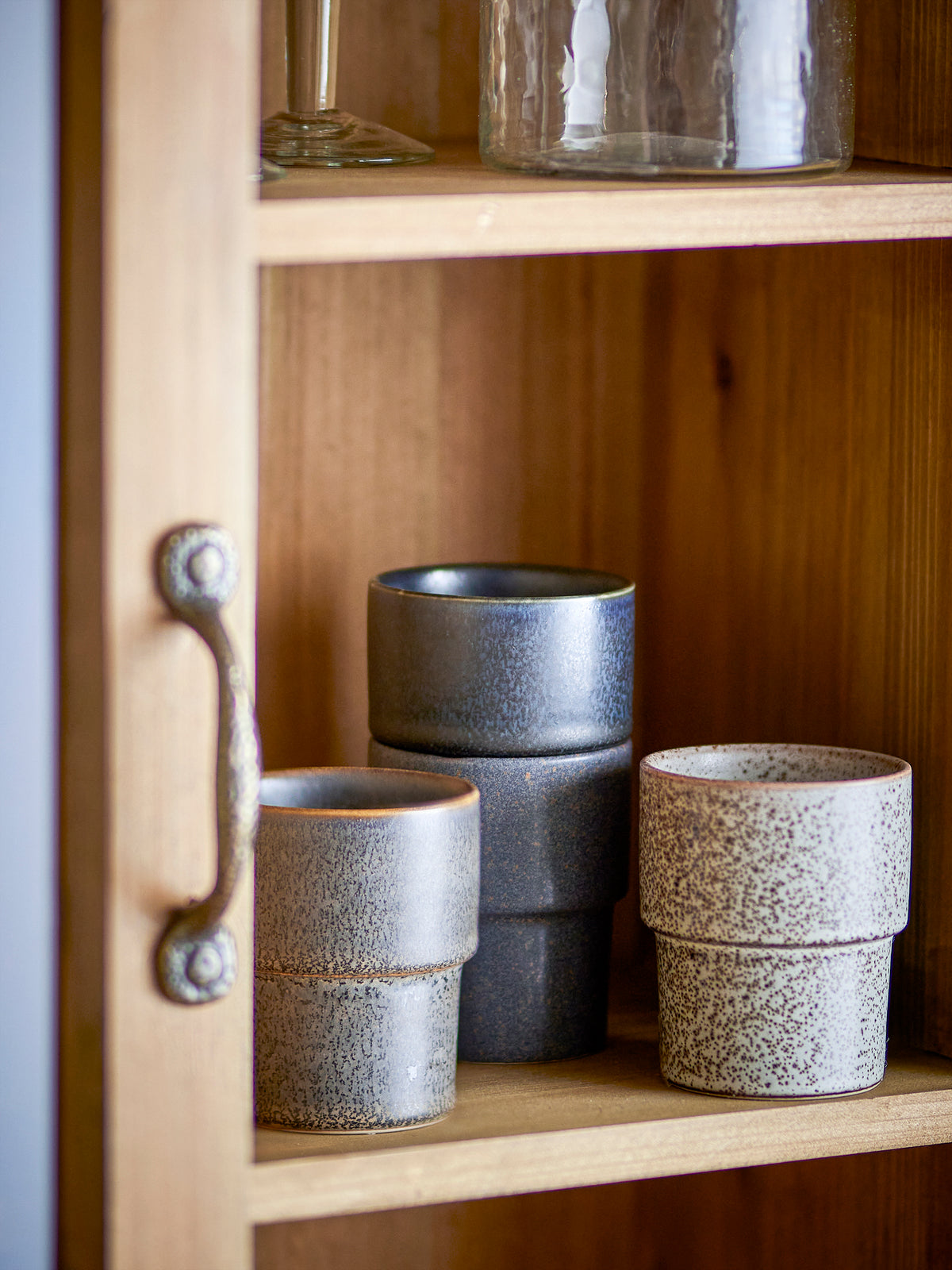 Ewan Cup set by Bloomingville displayed in wooden cabinet