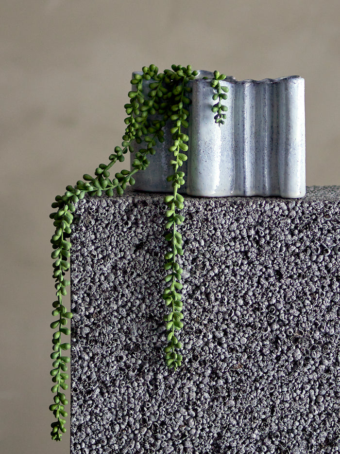 Faux trailing pearl plant styled in ceramic pot