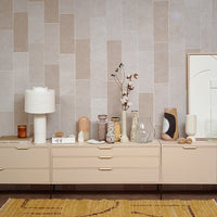 a number of hkliving vases and art pieces in a row on a furniture piece