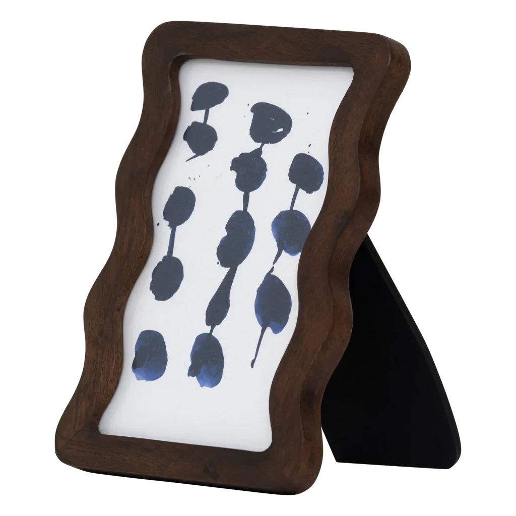 Flette walnut photo frame at an angle, showing the black back stand