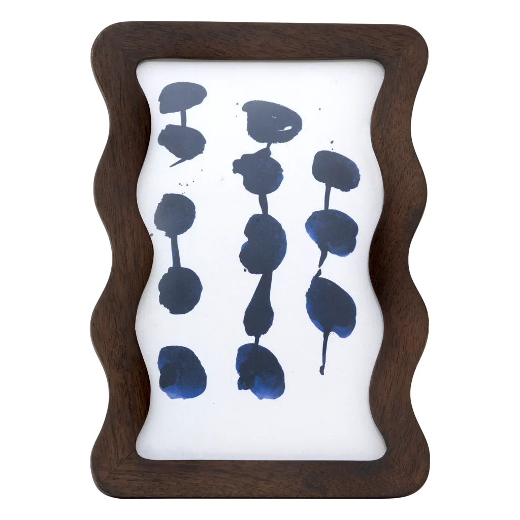 Flette wavy mango wood photo frame in walnut by Urban Nature Culture, front view with an abstract blue print