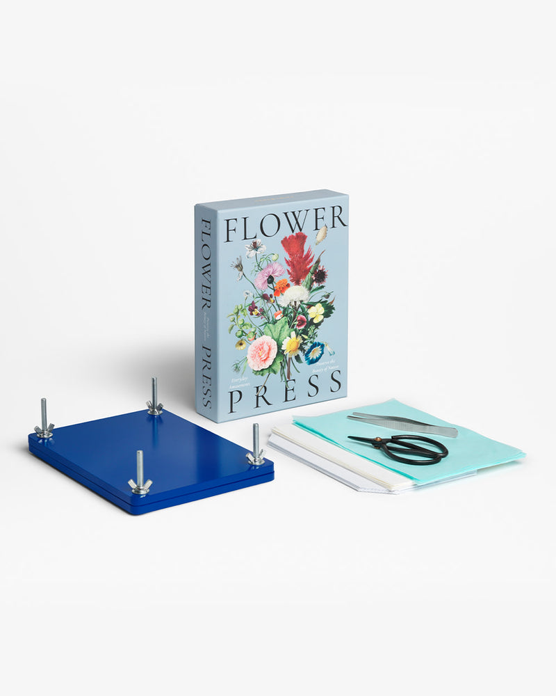 Flower press kit with blue plates, scissors, and floral box