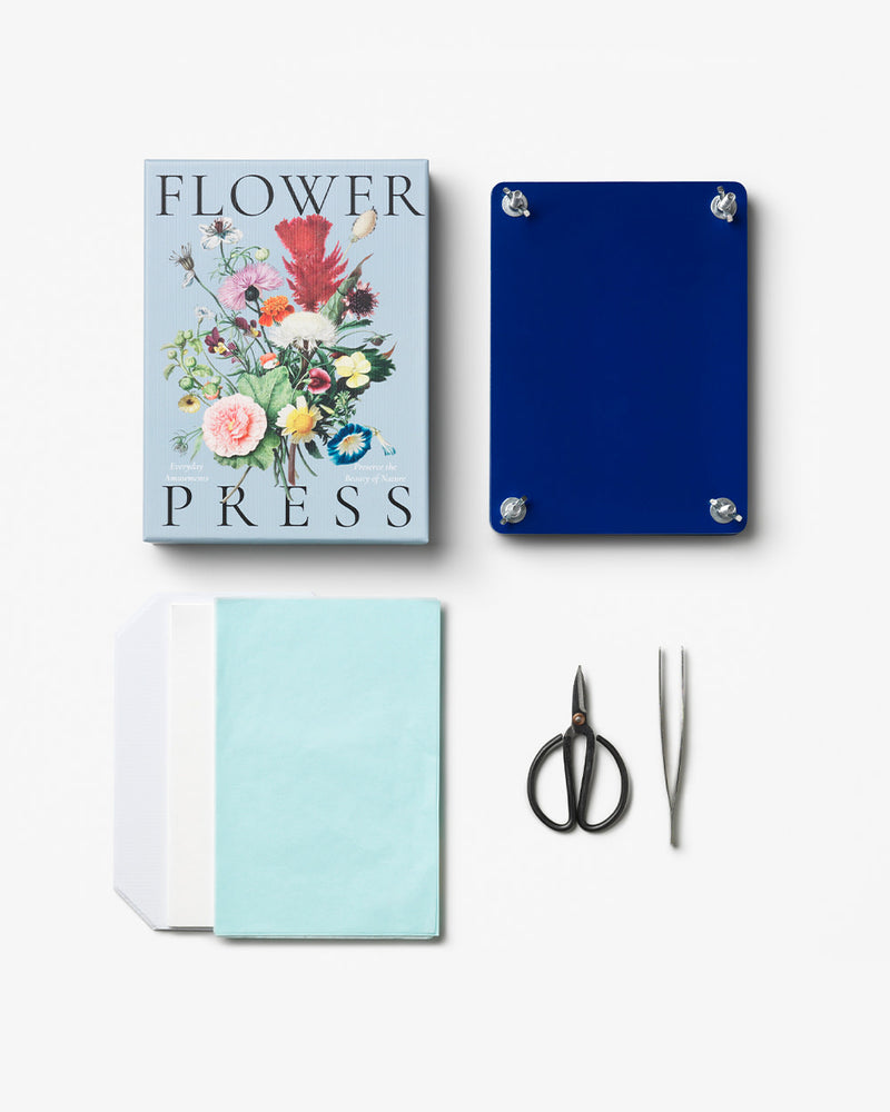 Flower press kit contents laid out next to floral box
