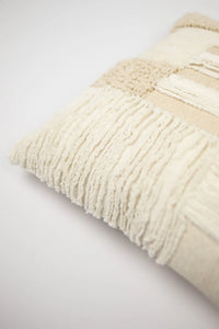 Corner detail of the Franca cream patchwork cushion by Olsson & Jensen