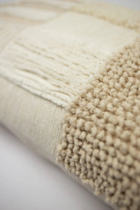 Close-up of the knotted and fringed cotton panels on the Franca cushion by Olsson & Jensen