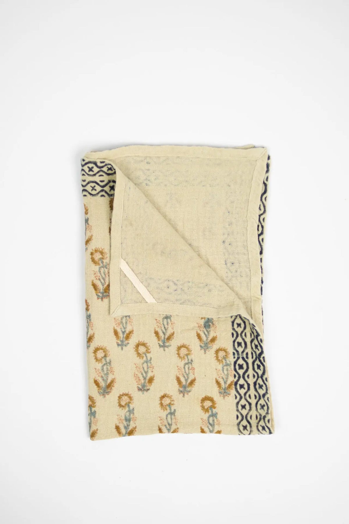 Franchette natural floral kitchen towel by Olsson & Jensen folded to show the patterned border