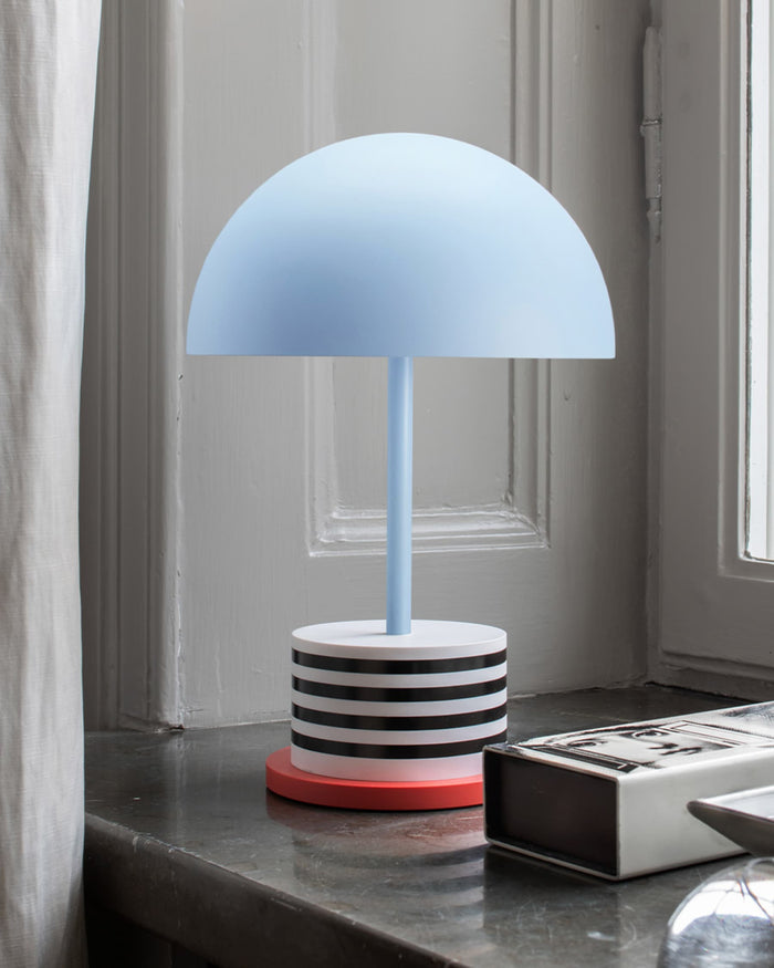 portable Printworks lamp in Riviera Stripes design on a windowsill with soft ambient light
