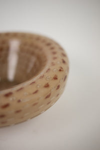 Close-up of the speckled pattern on the Gaston glass bowl by Olsson & Jensen