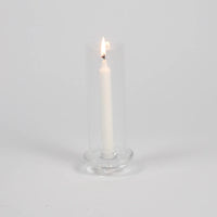 Gilly glass hurricane by Olsson & Jensen with a lit taper candle
