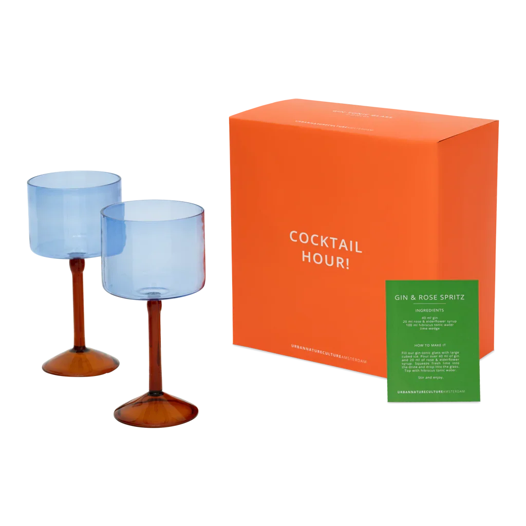 Two ice blue gin tonic glasses with the orange Cocktail Hour gift box and recipe card