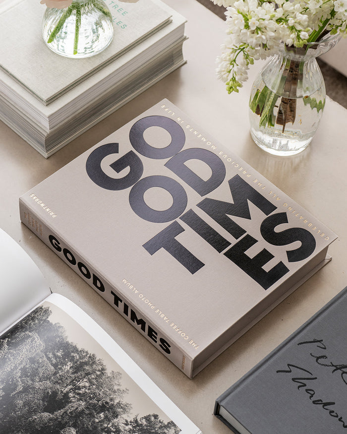 Grey cloth photo album with bold black typography reading “Good Times”
