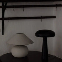 Grace small shade on a Colmar base beside a black Fungi lamp by Olsson & Jensen