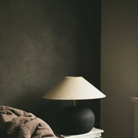 Grace small shade by Olsson & Jensen on a lamp in a moody dark interior