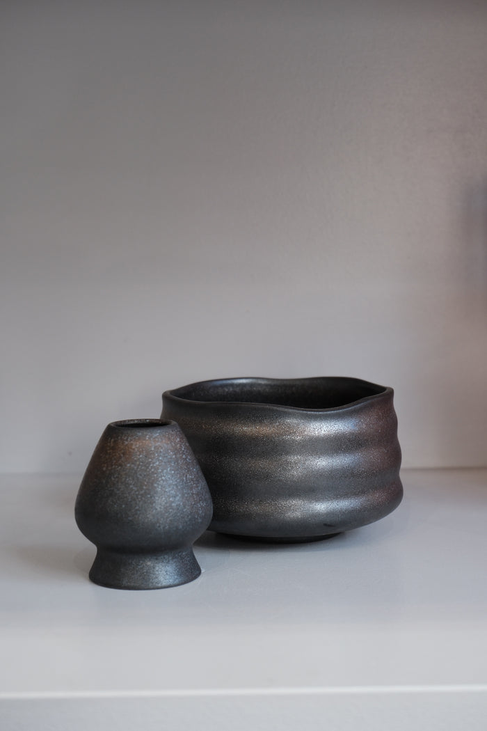 handmade graphite ceramic matcha bowl with finger grooves and dark glaze