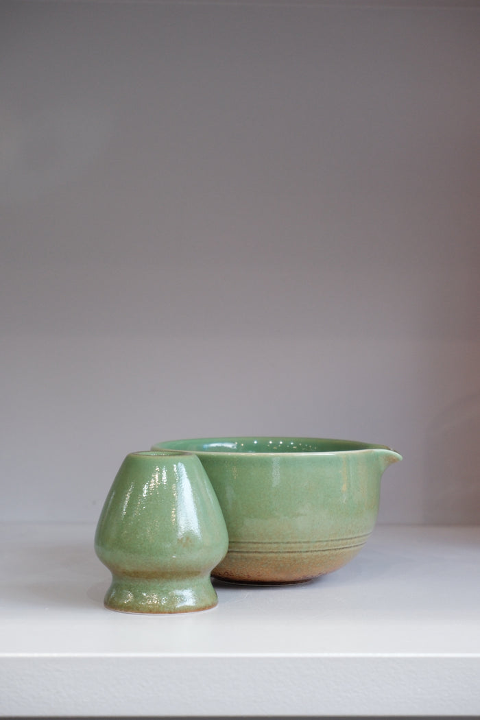 side view of green ceramic matcha bowl set showing pouring spout detail
