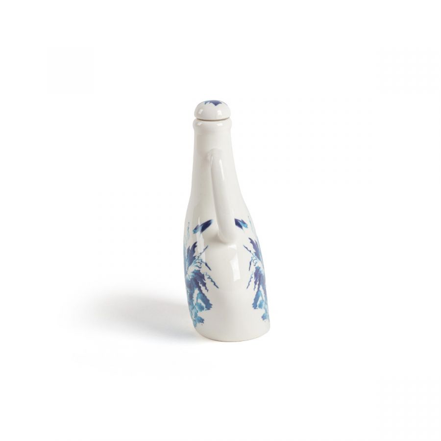 Classics on Acid HANA bottle styled on an eclectic dining table
