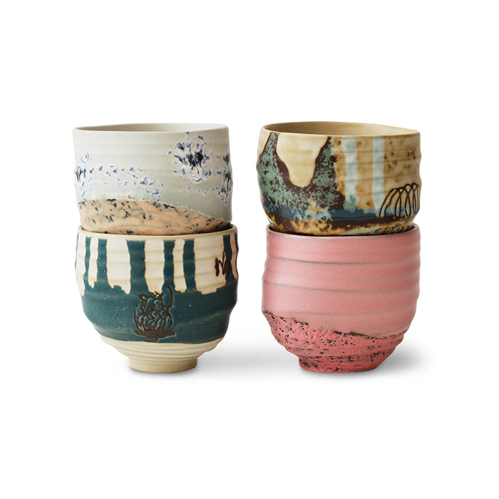 Handleless coffee cup from the Artist Ceramics set with textured glaze and throwing rings.
