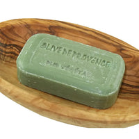 Natural olive soap with gentle fragrance for everyday use on a wooden soap dish