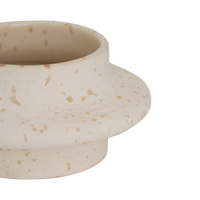 Close-up of the wavy silhouette and speckled finish on the Hea tealight holder