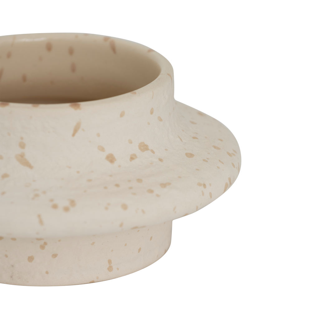 Close-up of the wavy silhouette and speckled finish on the Hea tealight holder