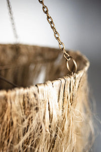 Close-up of the jute fringe and chain on the Hilda pendant by Olsson & Jensen