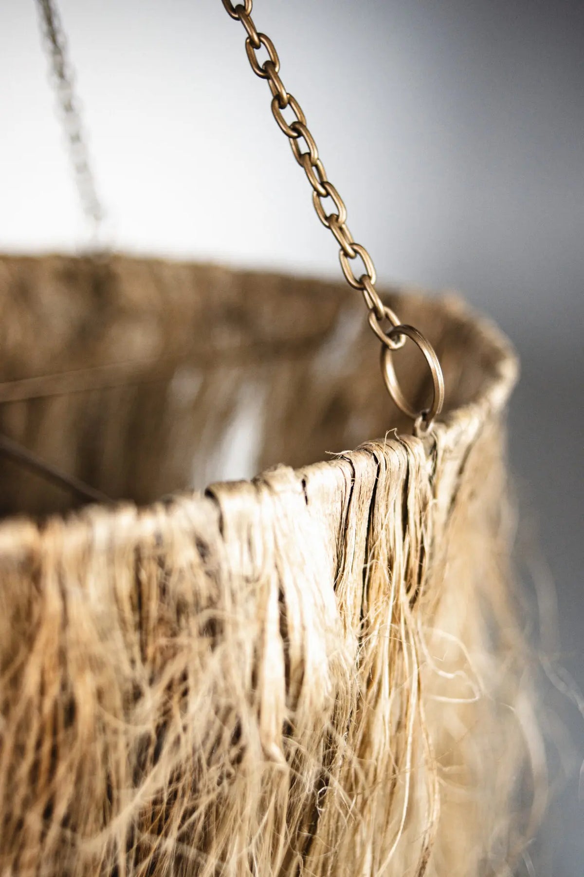 Close-up of the jute fringe and chain on the Hilda pendant by Olsson & Jensen