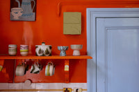 HKLIVING 70s ceramics café cup glint displayed on an orange kitchen shelf with hanging mugs
