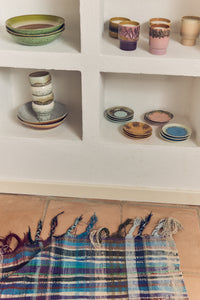 Assorted HKLIVING 70s Ceramics bowls and candles displayed in wall niches