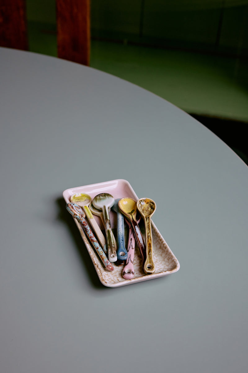 Assorted HKLIVING 70s Ceramics spoons styled in pink tray