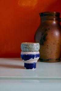 HKLIVING symbolist lungo mug showing layered glaze against a bold backdrop
