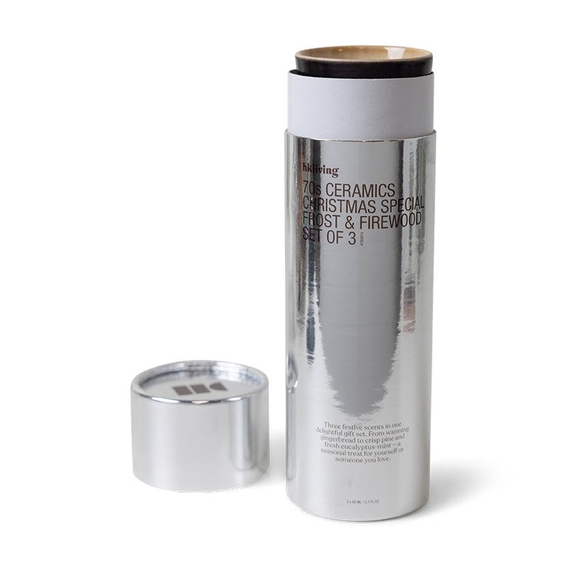 Open silver packaging with HKLIVING 70s ceramics candles – limited Frost & Firewood set
