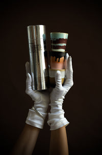 HKLIVING 70s Christmas candles and packaging held in gloved hands – luxury gift photography
