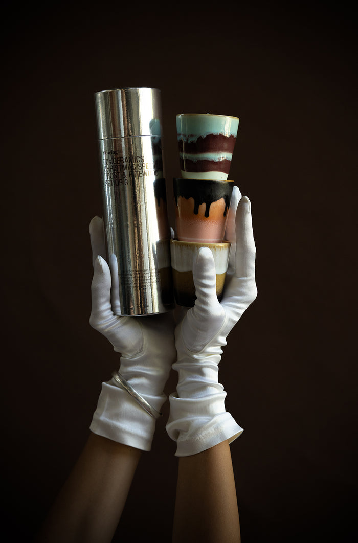 HKLIVING 70s Christmas candles and packaging held in gloved hands – luxury gift photography
