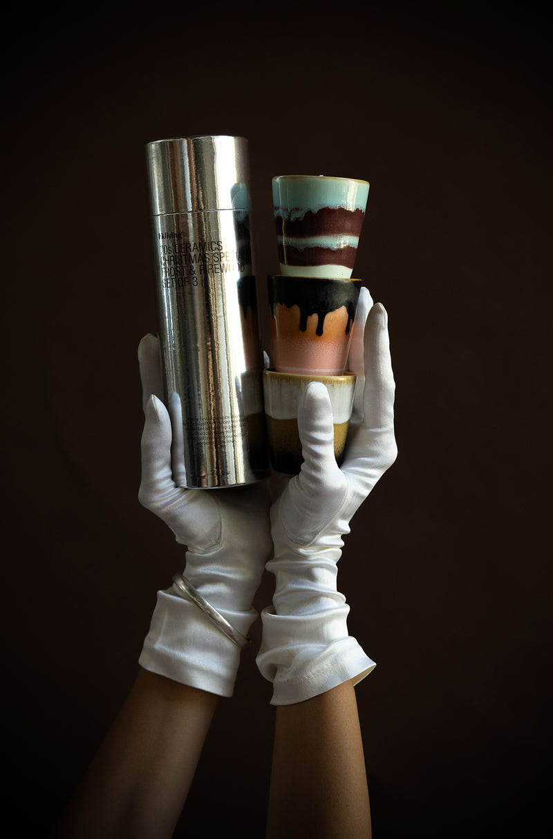 HKLIVING 70s Christmas candles and packaging held in gloved hands – luxury gift photography
