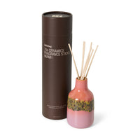 Close-up of HKLIVING Miami reed diffuser bottle and brown tube packaging
